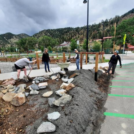 Volunteers work  placing the rocks