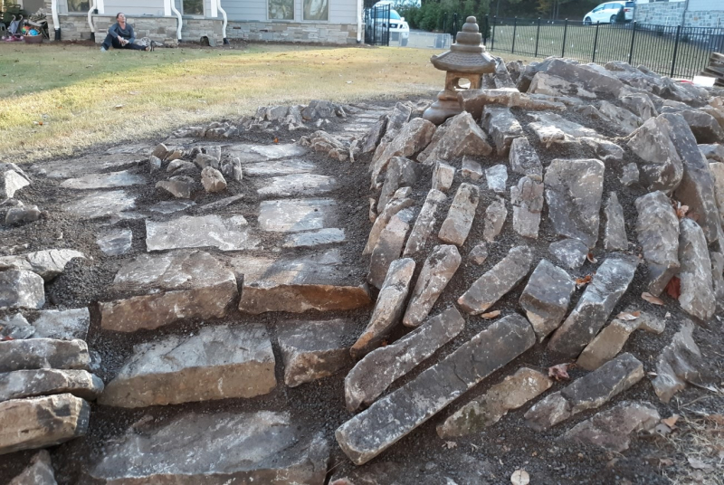 Stone toro (Japanese lantern) in place on the stonework Stone toro (Japanese lantern) in place on the stonework