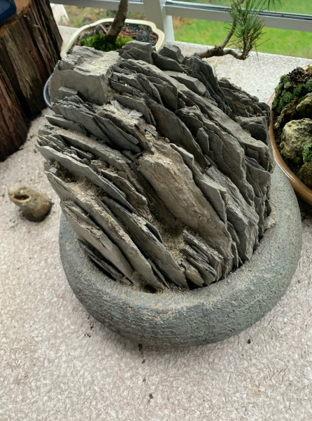 The process of building a crevice garden in a container. The process of building a crevice garden in a container.