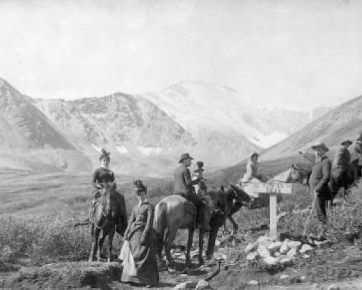 Gray’s Peak climbing party. Horses, trail guides, and high fashions were standard for tourist trips to the summit. The cost was $9 and included train ride to and from Denver and stays at both the Jennings Hotel and Kelso Cabin. Eastwood and Wallace hiked to the summit instead.  Photo from Denver Public Library Western History Archives