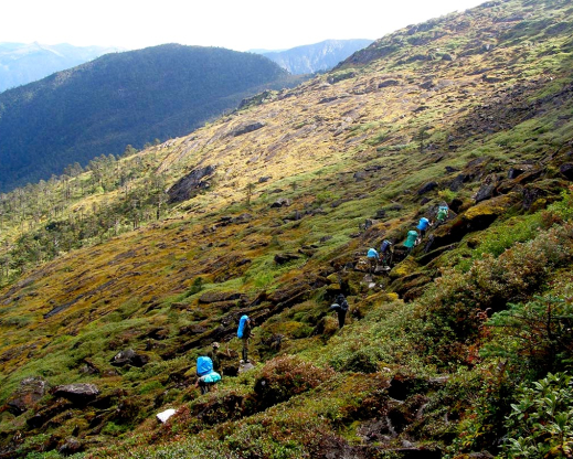 Following our porters on the Pemako Trek above Tuting Following our porters on the Pemako Trek above Tuting