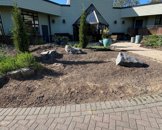 Graded and new boulders in place